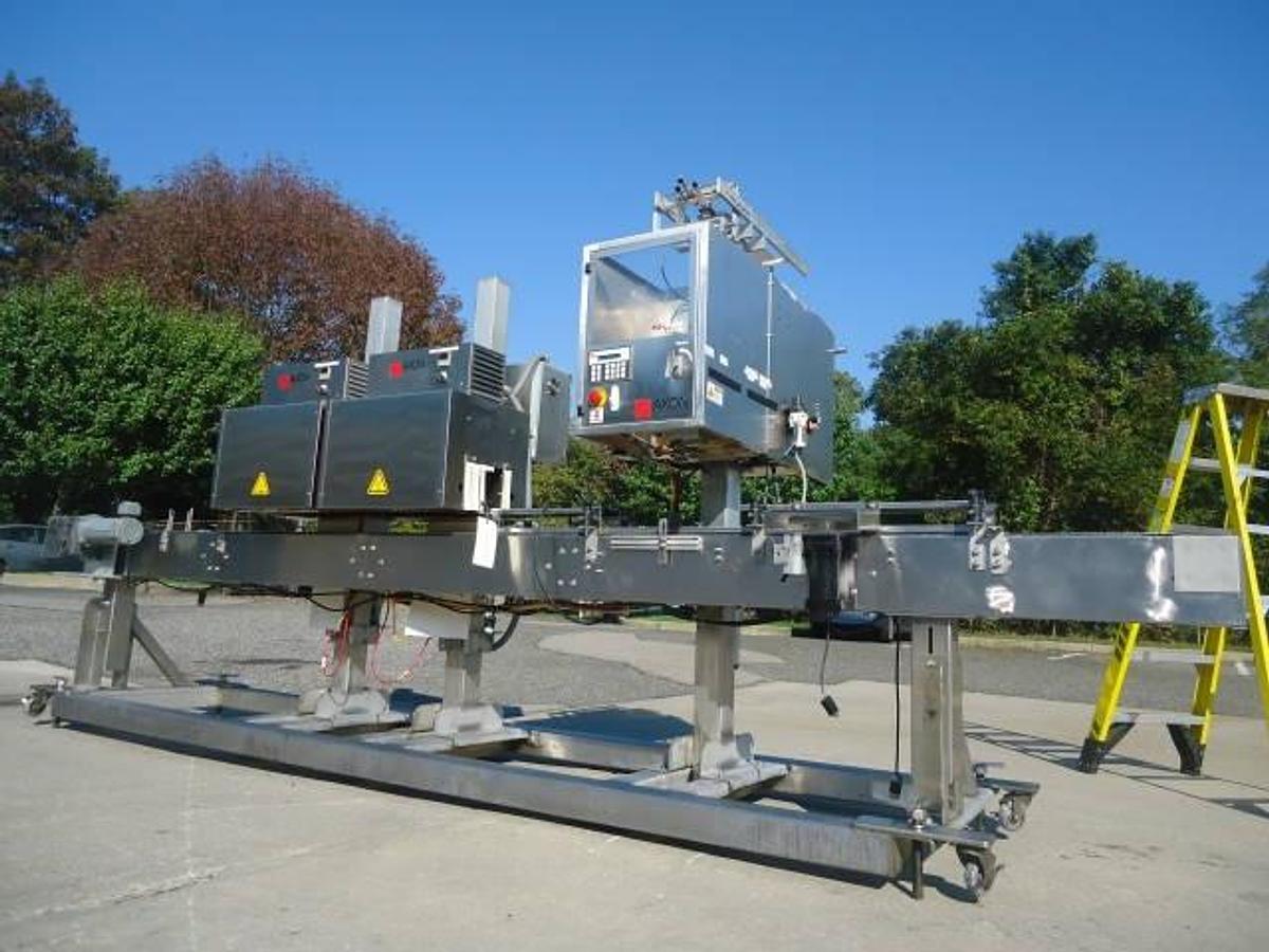Used Axon Ez-130 Sleeving System With Twin Shrink Tunnels, 15 Ft. Conveyor
