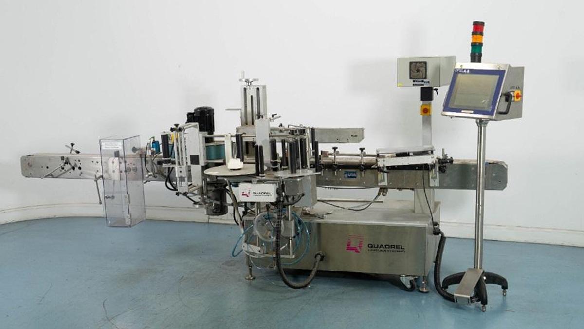 Used Quadrel VersaLine Spot/Wraparound Pressure Sensitive Labeler
