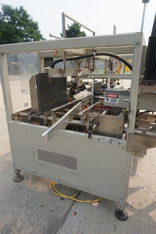 Used Packo-Matic Case Packaging Machine, Nordson Gluing