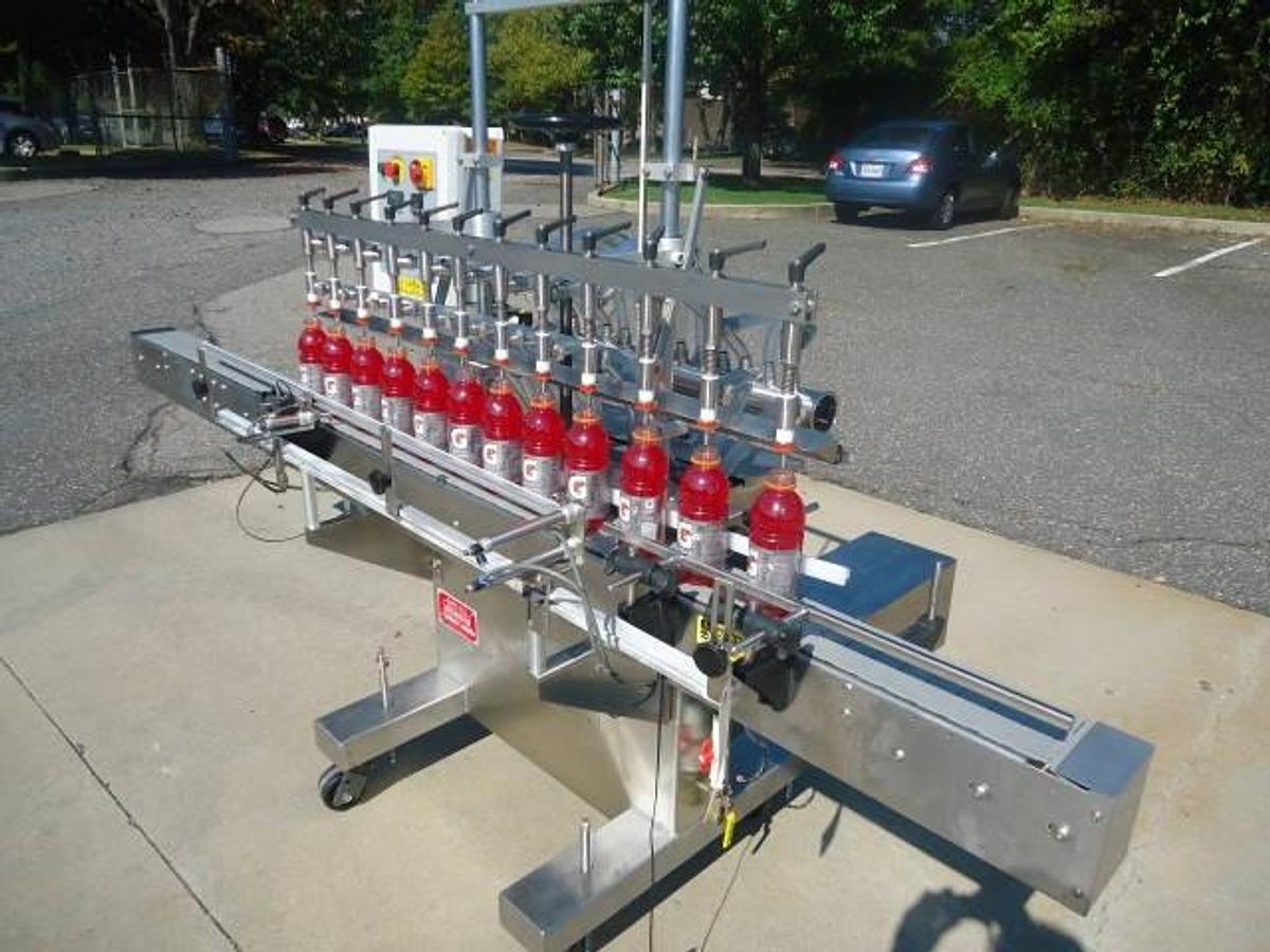 Used Kaps-All Twelve Spout Inline Pressure Filler Model Fa-P