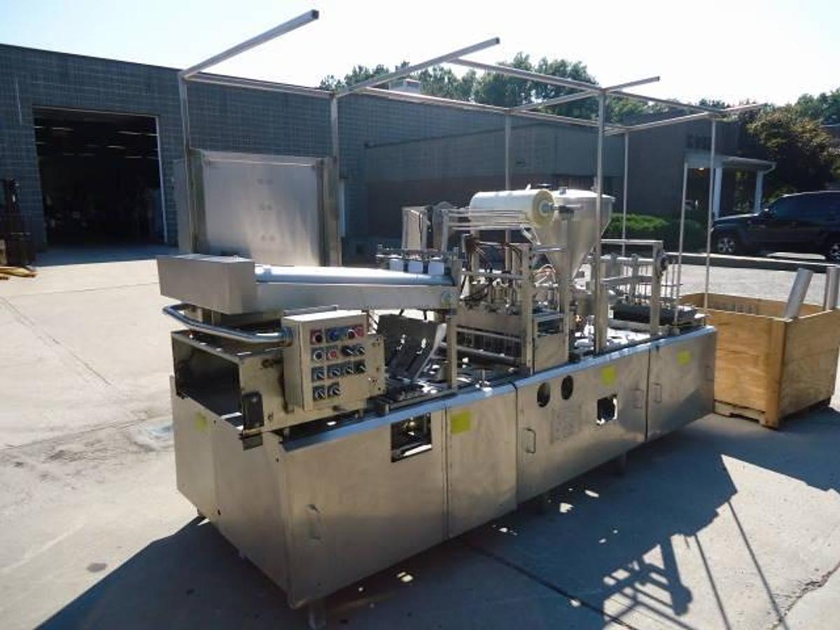Used Modern Packaging Three Lane Cup Filler/Sealer/Lidder , Stainless Steel
