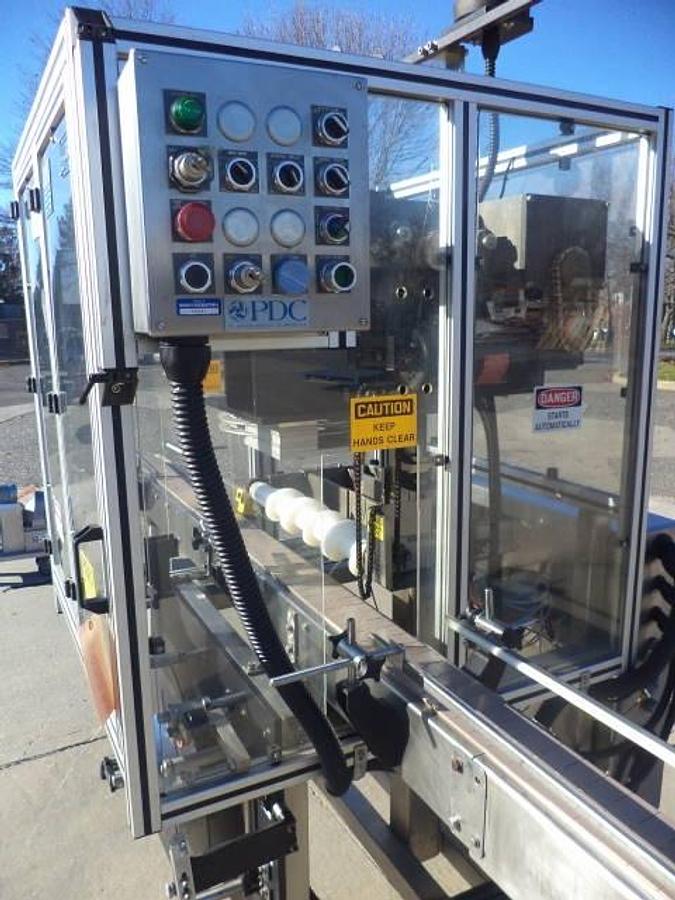 Used PDC 65-M Tamper Evident Neck Bander/Sleever, 200 pm