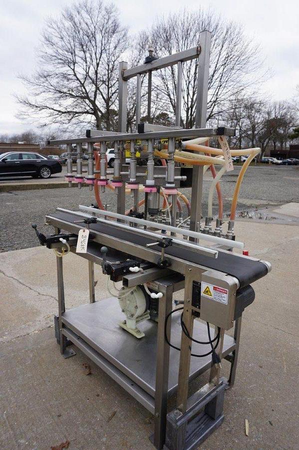 Used 8 Spout Straight Line Liquid Overflow Filler With Diaphragm Pump