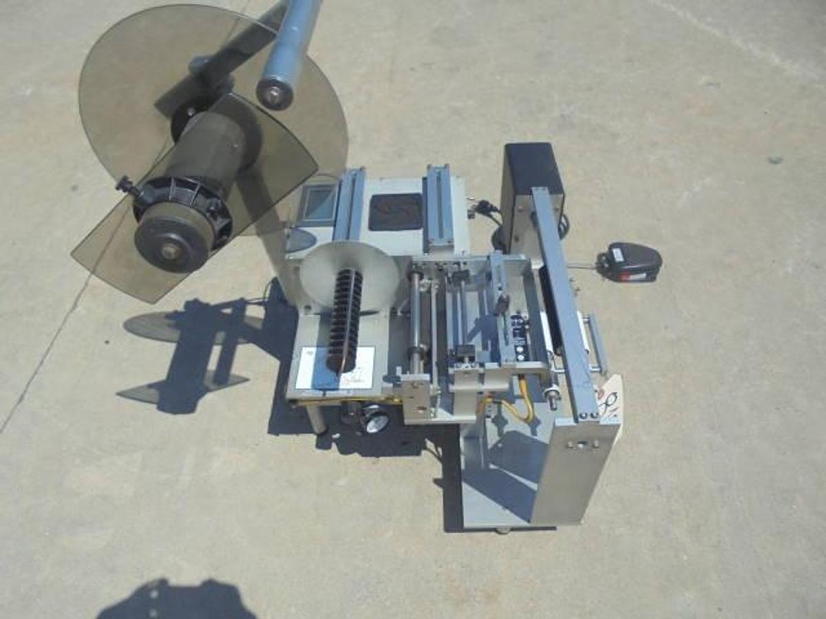 Used Universal R310 Tabletop Semi-Auto Pressure Sensitive Spot/Wraparound Labeler