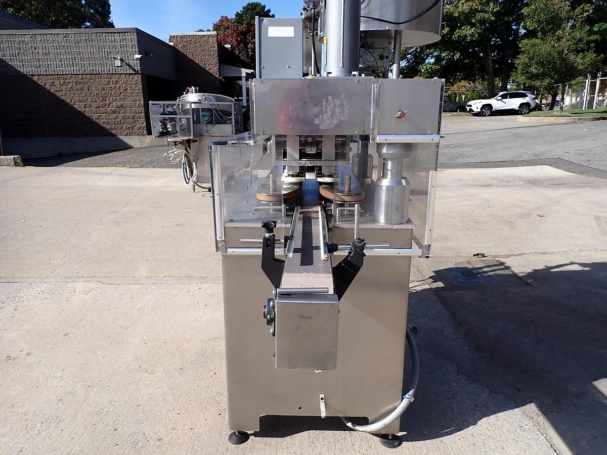 Used Kaps-All Model C Automatic Eight Spindle Capper, 200 Per Minute