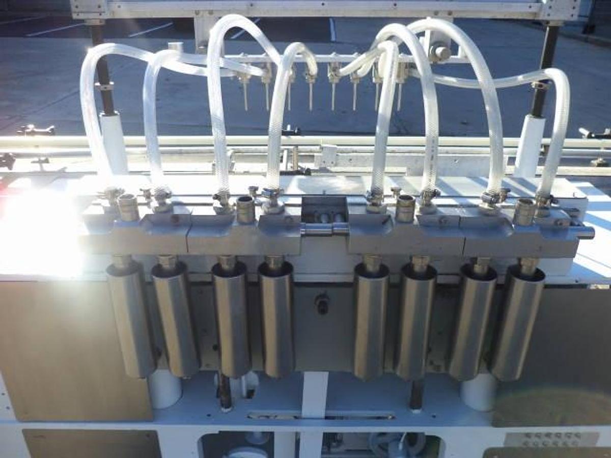 Used Cozzoli Eight Piston Straight Line Automatic Filing Machine, 240cc Pistons