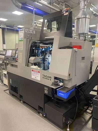 Usato TORNIO CNC A FANTINA MOBILE TSUGAMI B0386E-III CON CARICATORE DI BARRE TOP AUTOMAZIONI RES 442