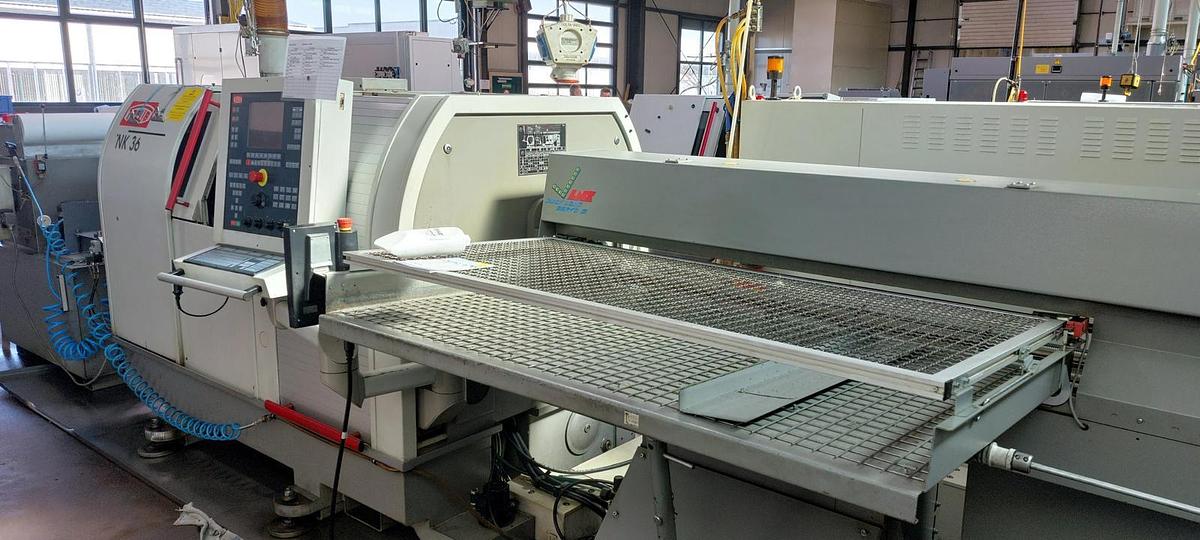 Used Tornio testa fissa TRAUB TNK36 D14 completo di caricatore di barre