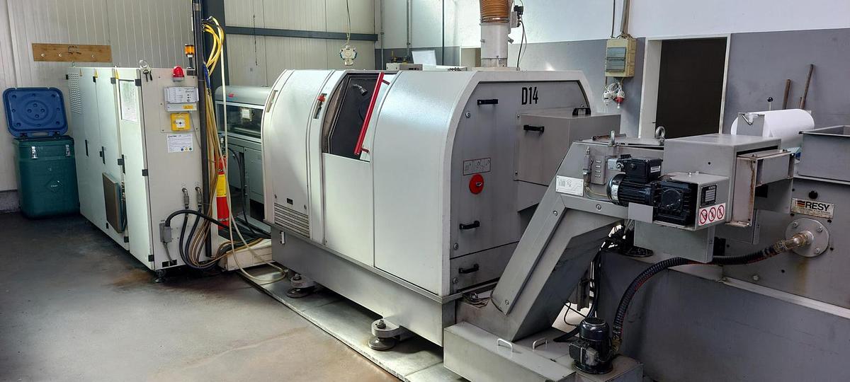 Used Tornio testa fissa TRAUB TNK36 D14 completo di caricatore di barre