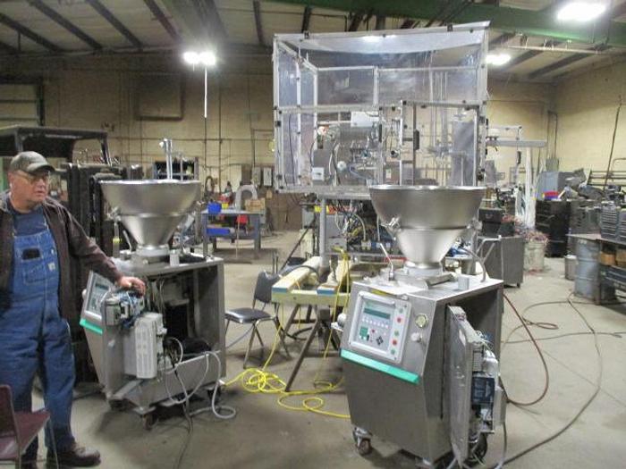 Used World Cup Filling Line with (2) Vemag Robby Fillers and Control GMC Lid applicator