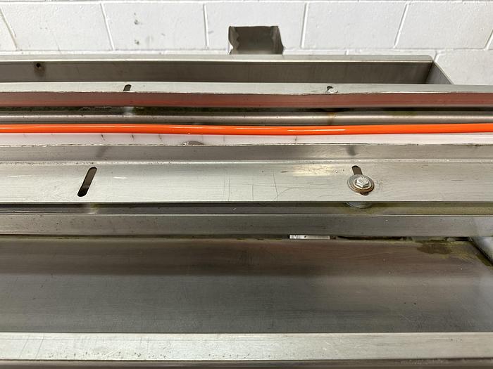 Used A&B Volumetric Clamshell Filler