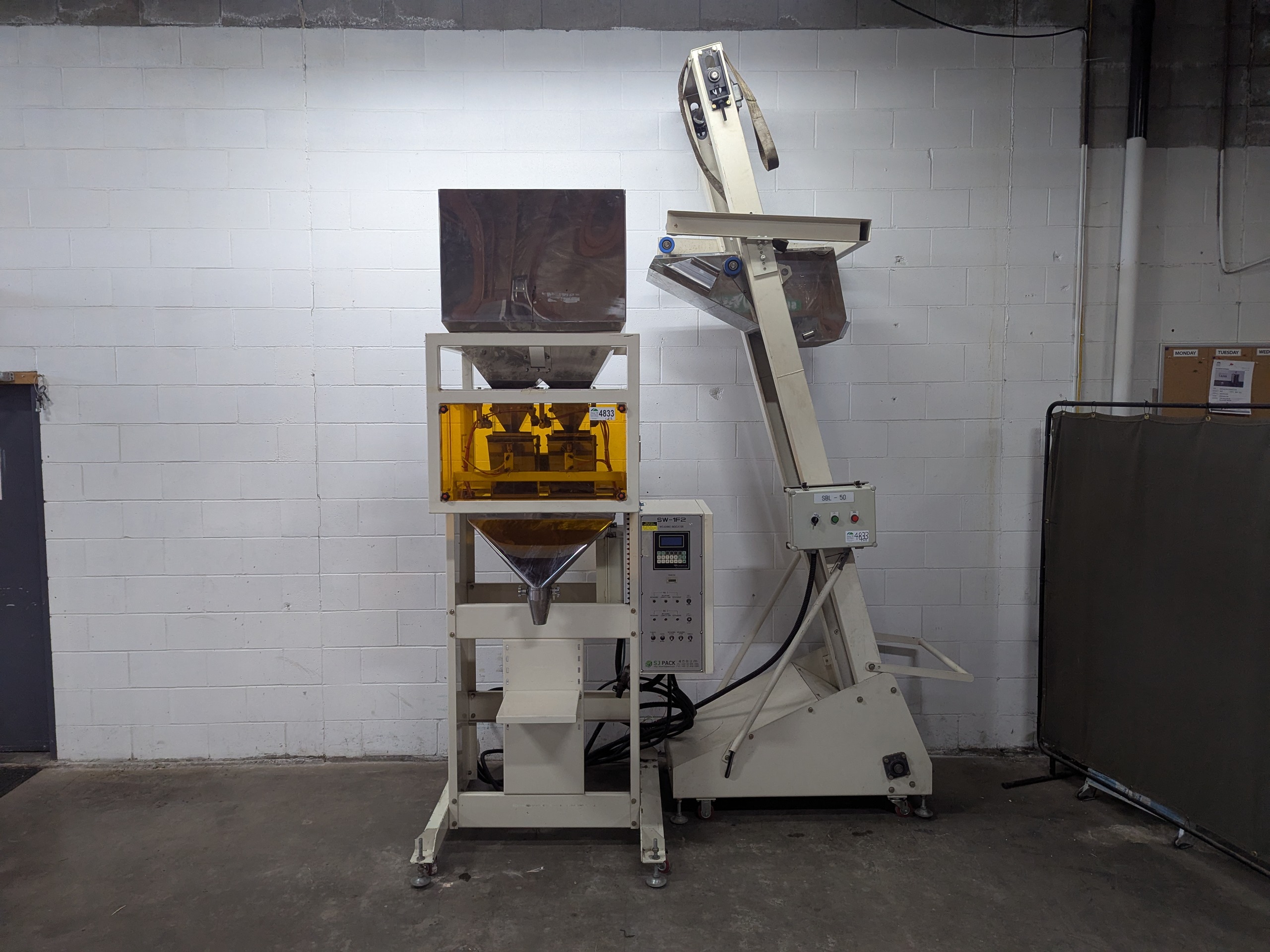 Used Dual Head Net Weigh Filler with Bucket Elevator Infeed