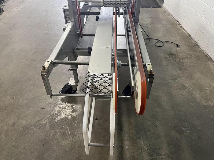 Used Lakewood 31025 Volumetric Clamshell Filler