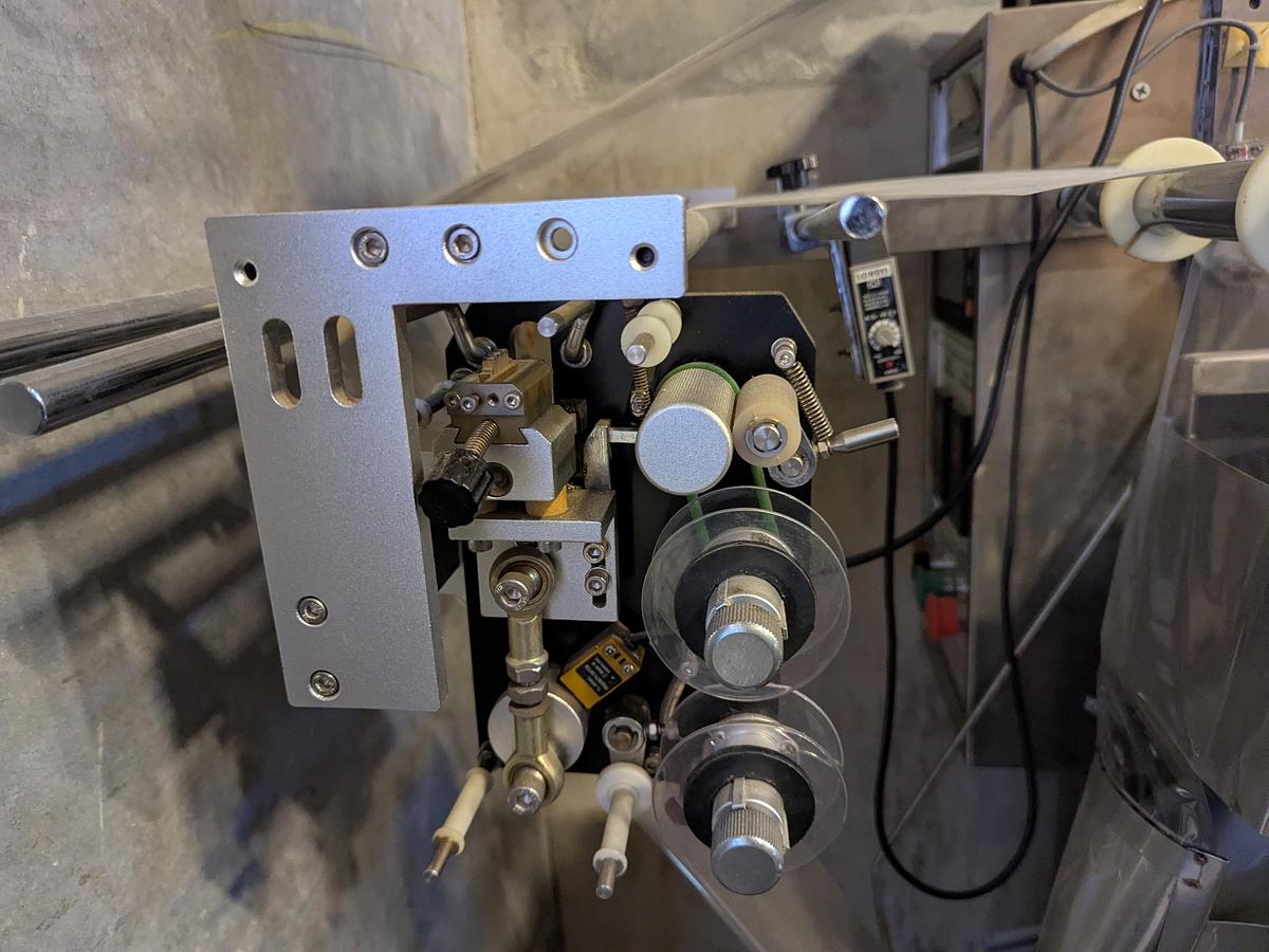 Used Flow Packer with Bucket Infeed