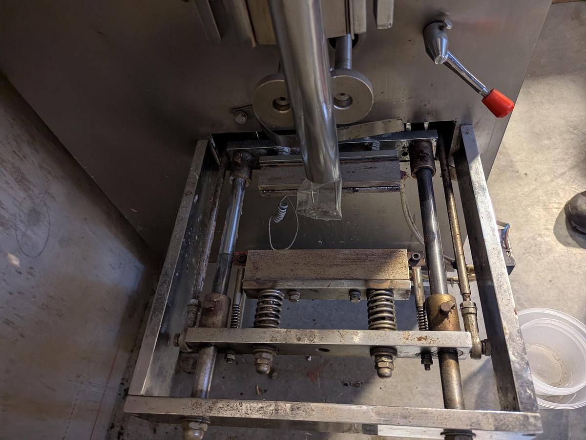 Used Flow Packer with Bucket Infeed