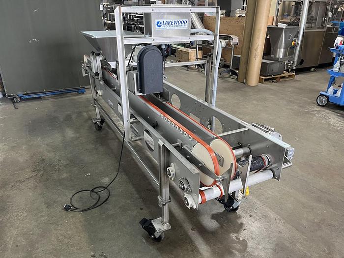 Used Lakewood 31025 Volumetric Clamshell Filler