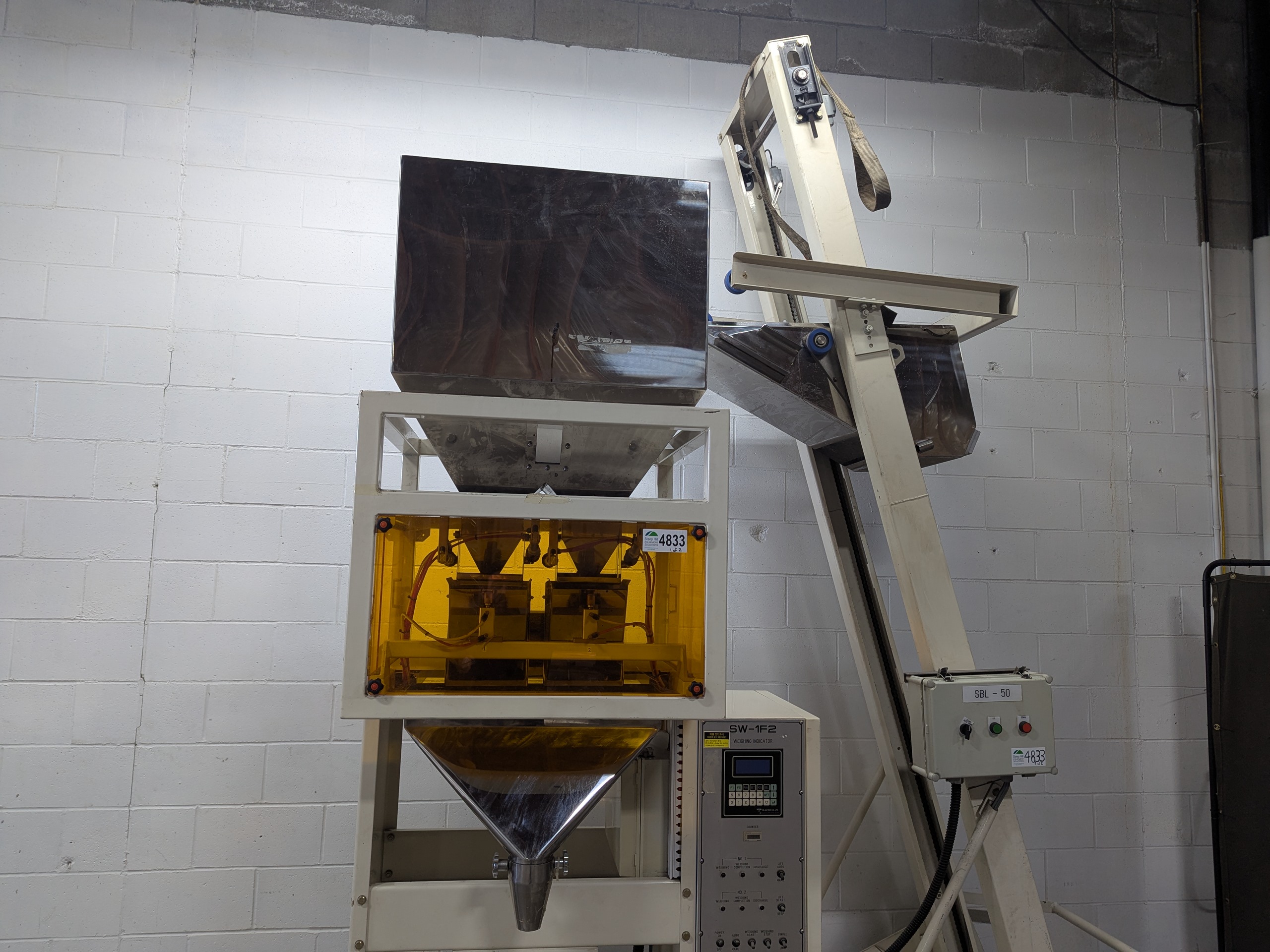 Used Dual Head Net Weigh Filler with Bucket Elevator Infeed