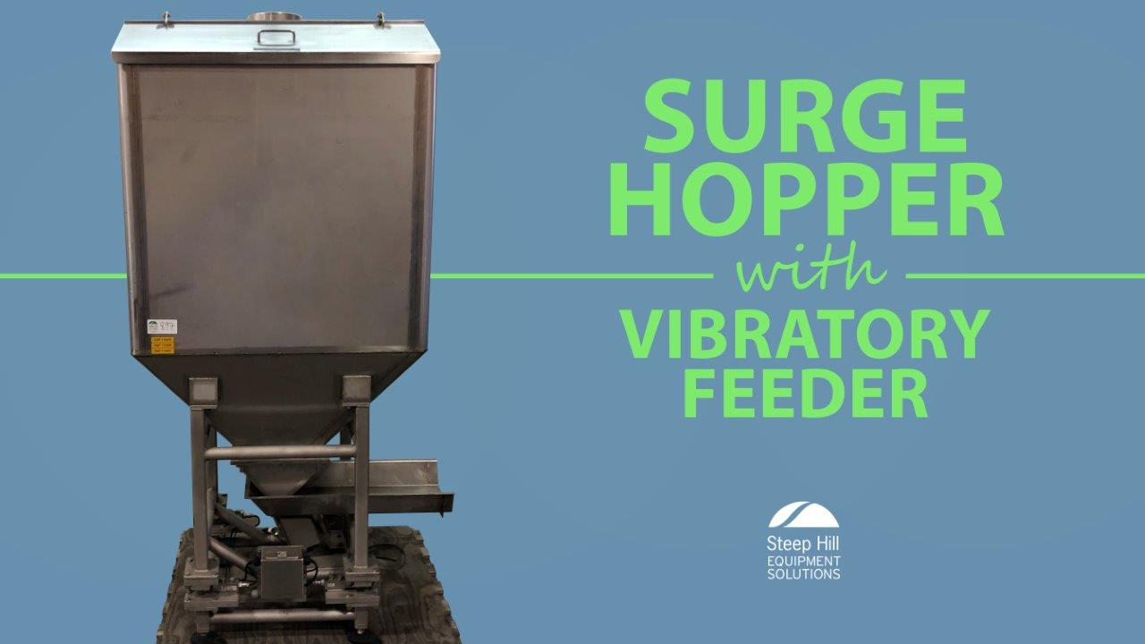 Used Hartman Surge Hopper with Vibratory Feeder