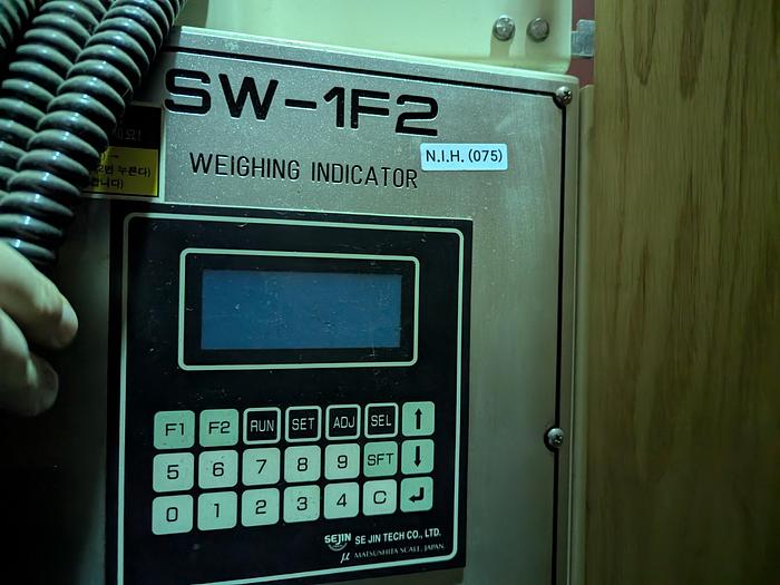 Used Two-Head Vibratory Filler with Elevator