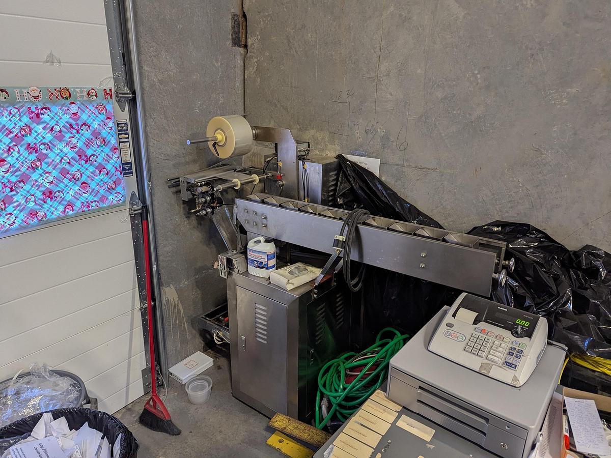 Used Flow Packer with Bucket Infeed