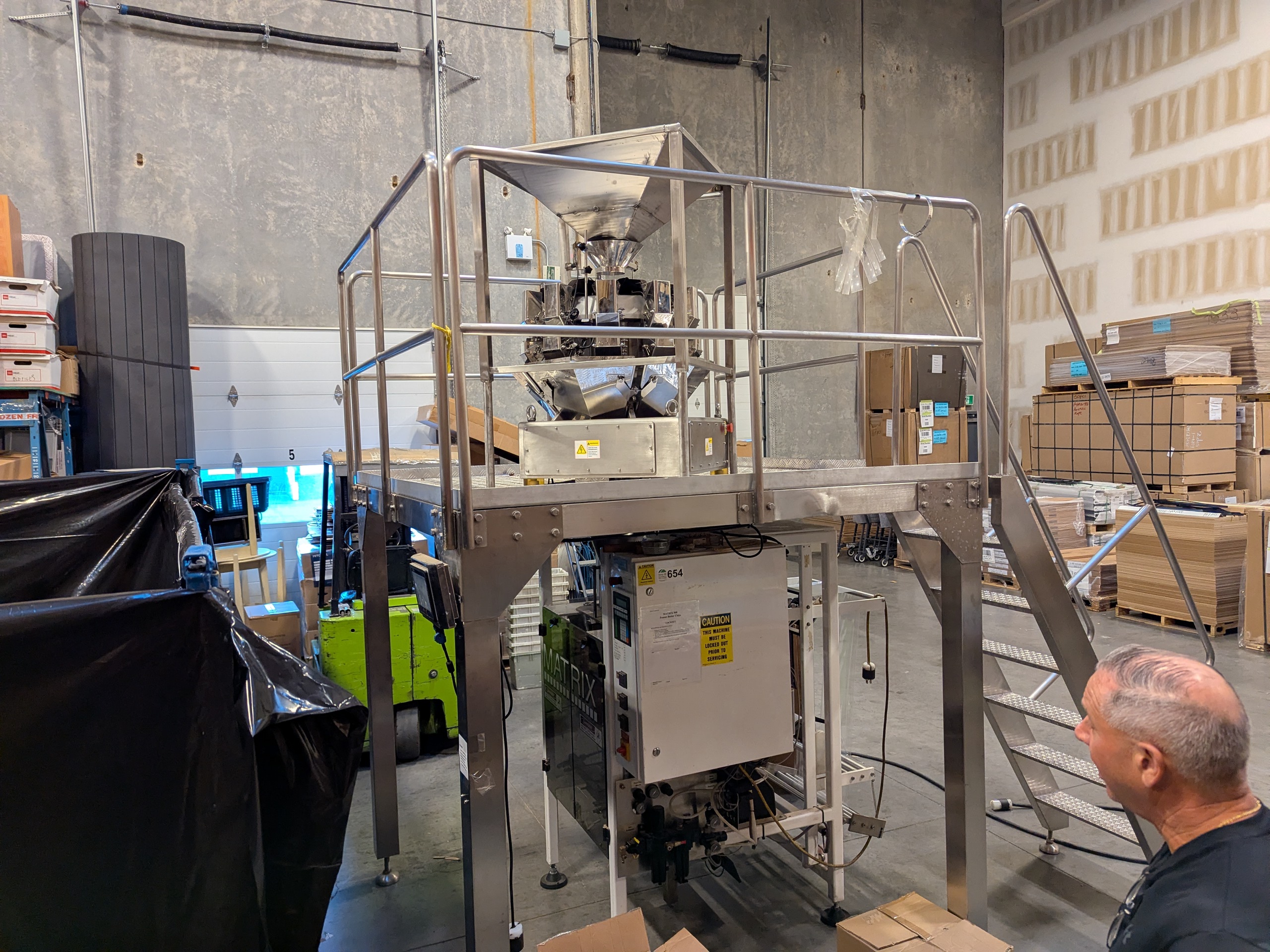 Used Matrix 916R Bagger with Platform and 10 Head Scale