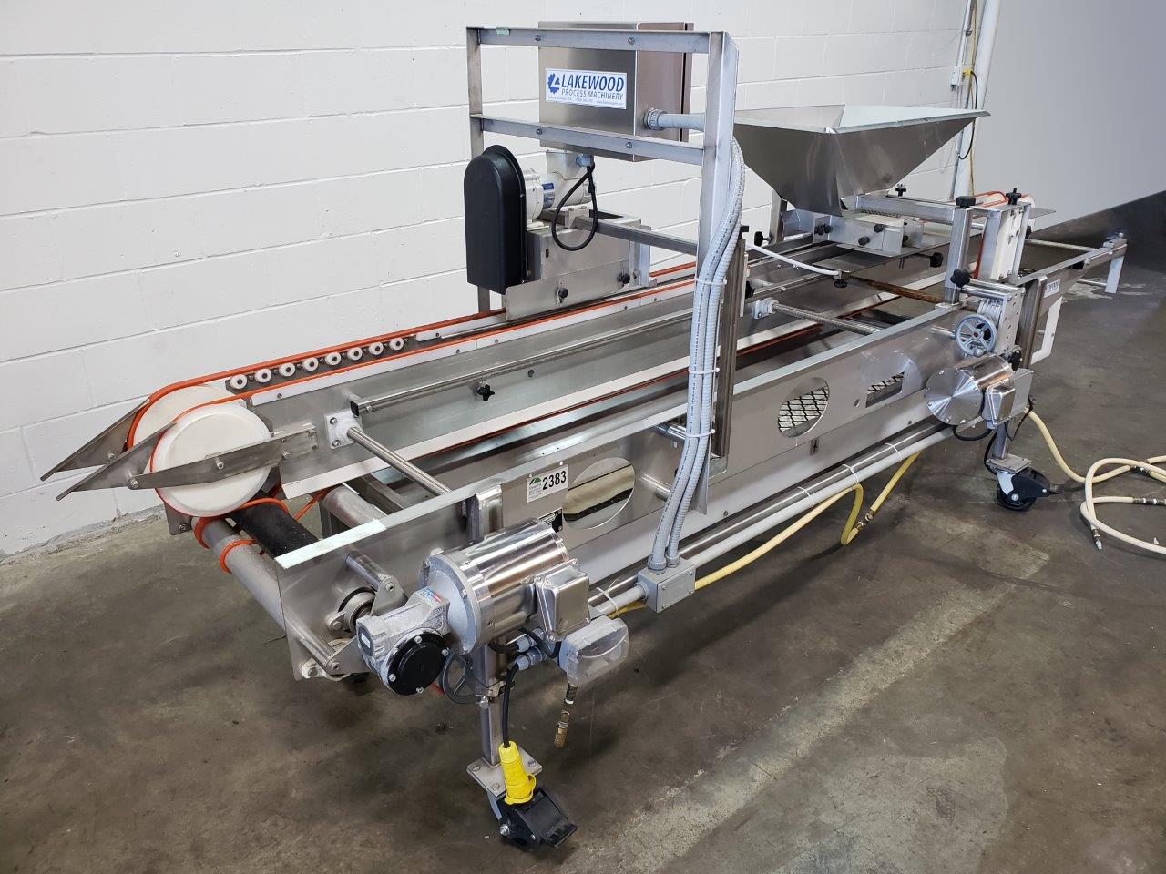 Used Lakewood Volumetric Clamshell Filler