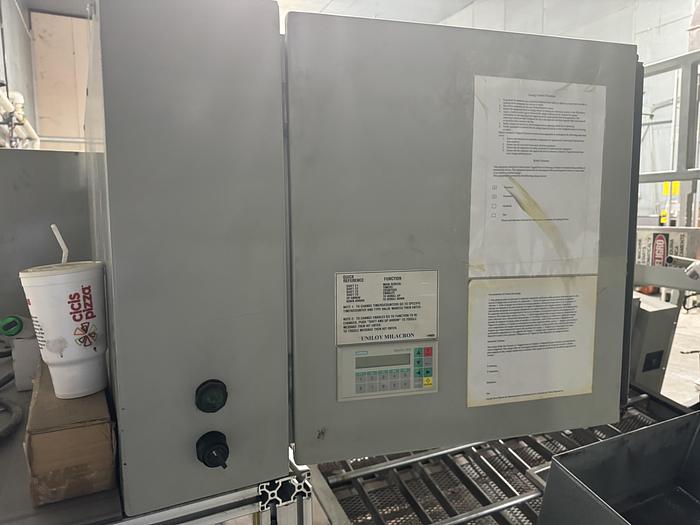 Used UNILOY R2000 BLOWMOLDER WITH 10041 TRIMMER AND COOLING BED 