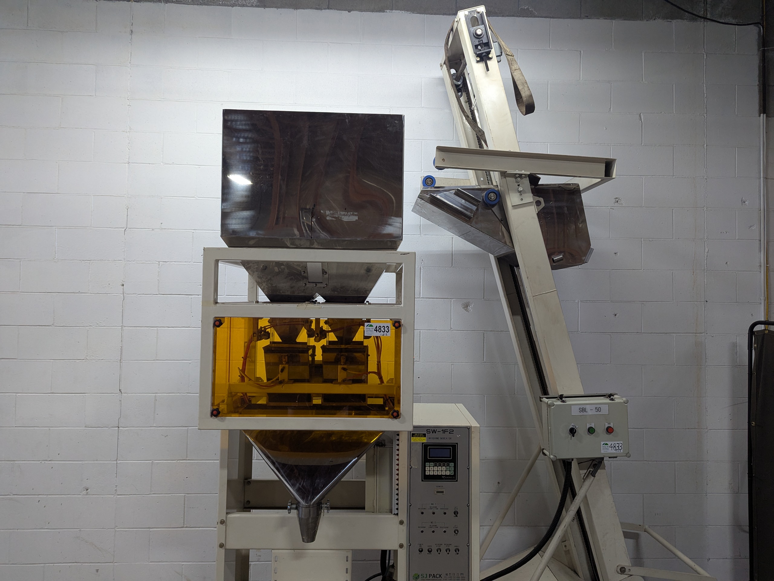 Used Dual Head Net Weigh Filler with Bucket Elevator Infeed