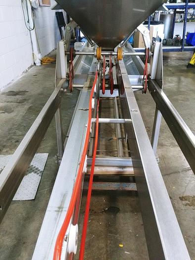 Used A&B Volumetric Clamshell Filler