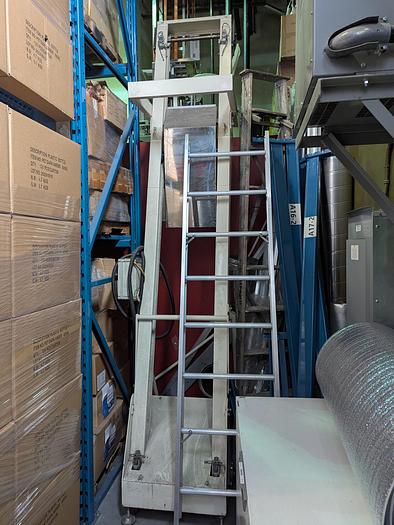 Used Two-Head Vibratory Filler with Elevator