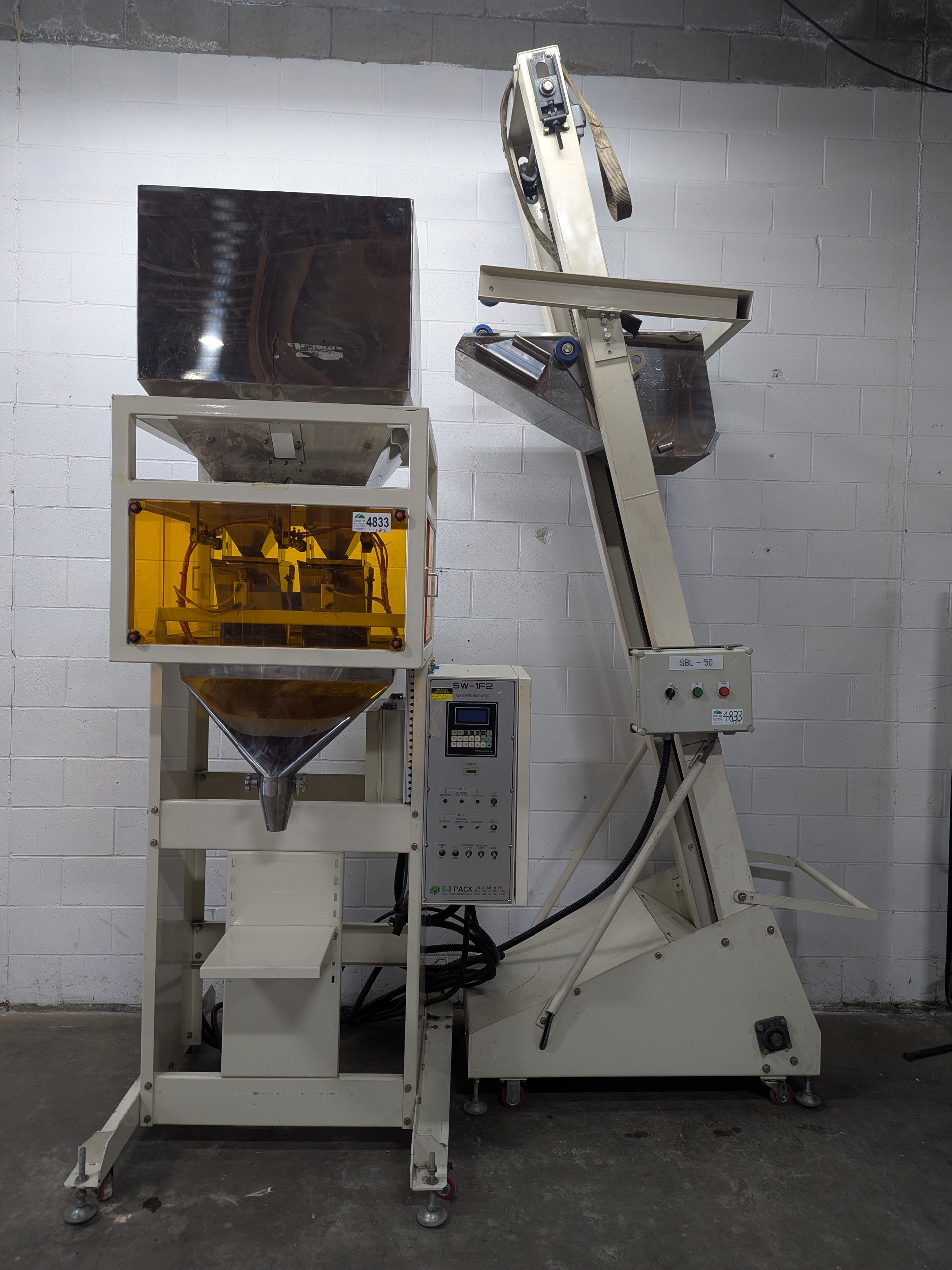 Used Dual Head Net Weigh Filler with Bucket Elevator Infeed