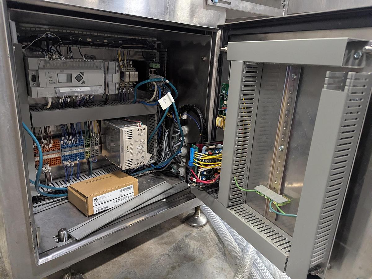 Used Aesus 6-Head Filling Line with Descrambler. Labeler, Filler, Capper, Induction Sealer & Accumulation Table