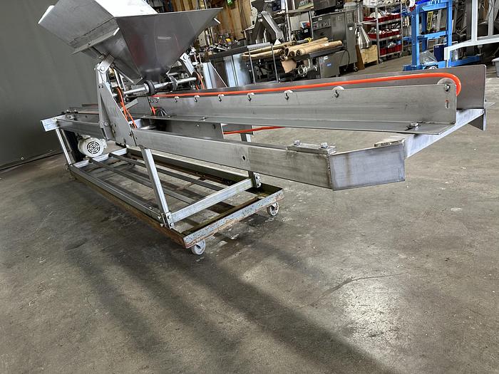 Used A&B Volumetric Clamshell Filler