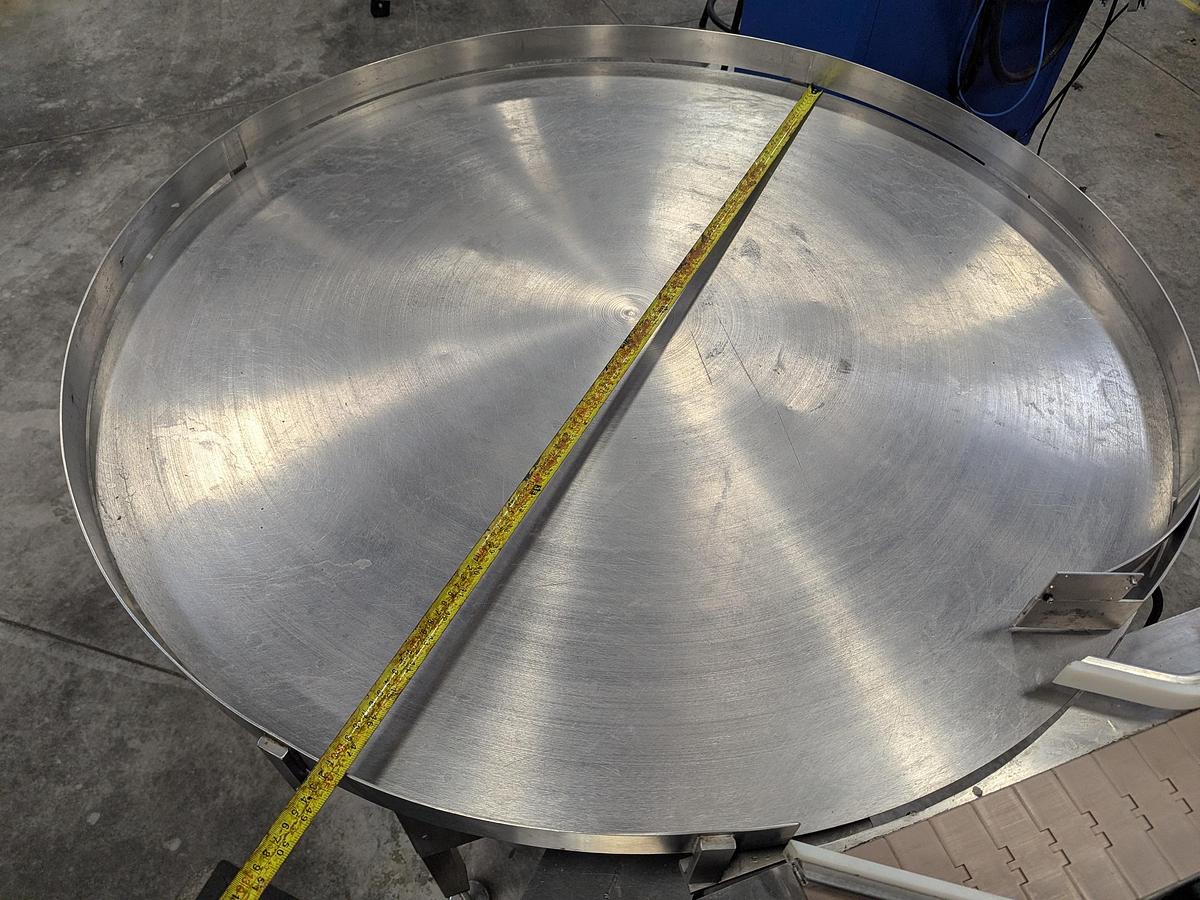 Used Aesus 6-Head Filling Line with Descrambler. Labeler, Filler, Capper, Induction Sealer & Accumulation Table