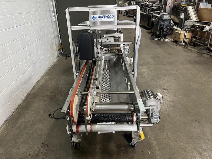 Used Lakewood 31025 Volumetric Clamshell Filler