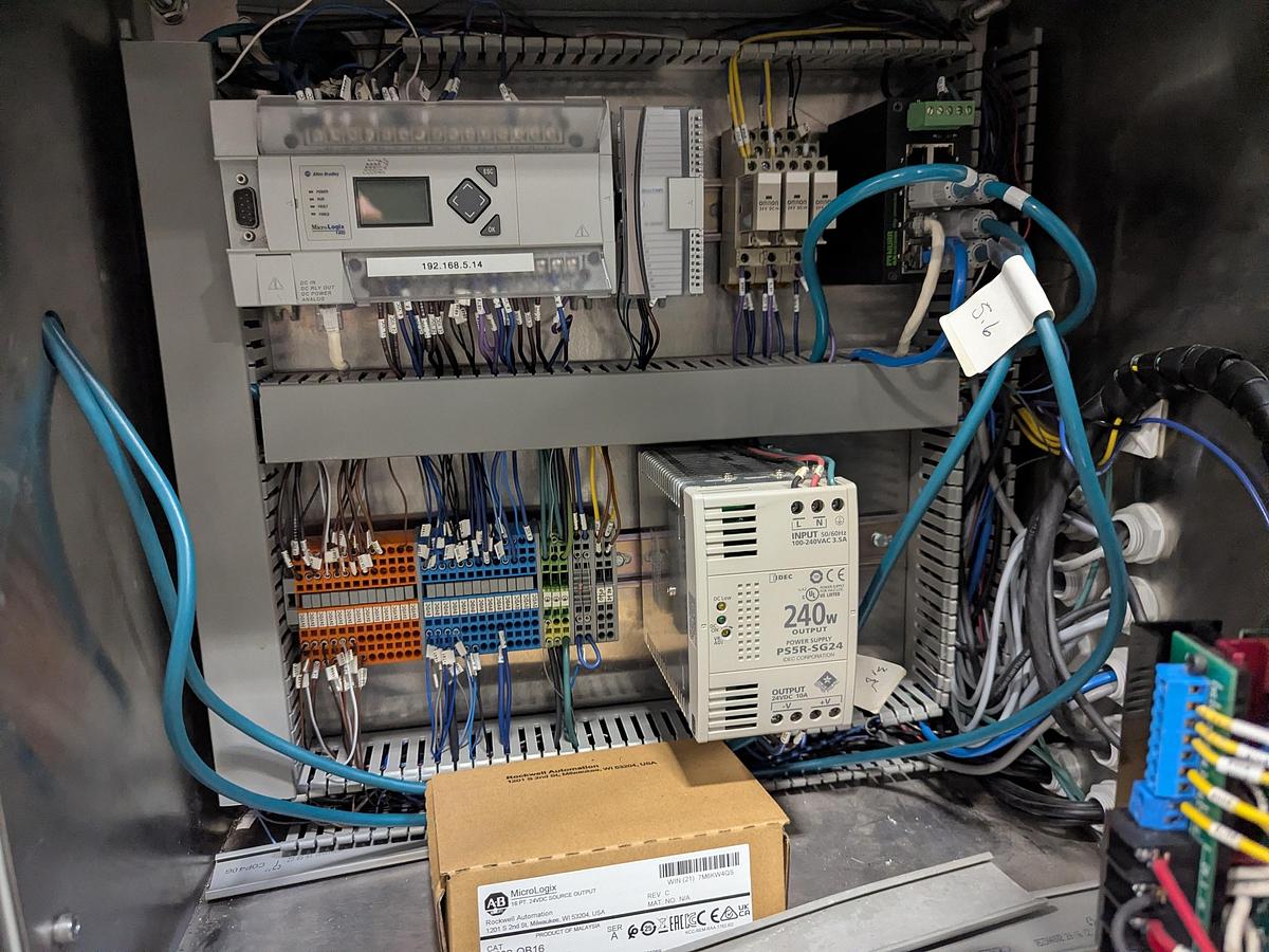 Used Aesus 6-Head Filling Line with Descrambler. Labeler, Filler, Capper, Induction Sealer & Accumulation Table