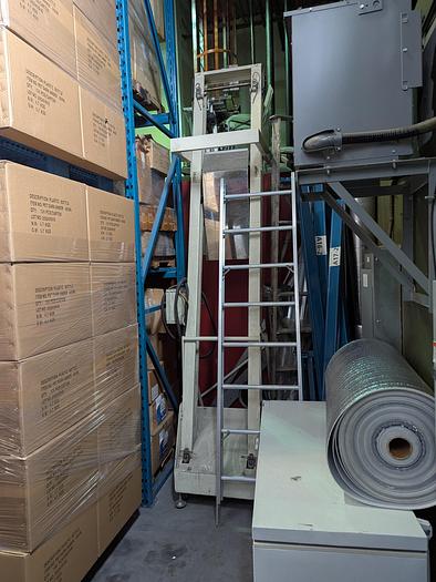 Used Two-Head Vibratory Filler with Elevator