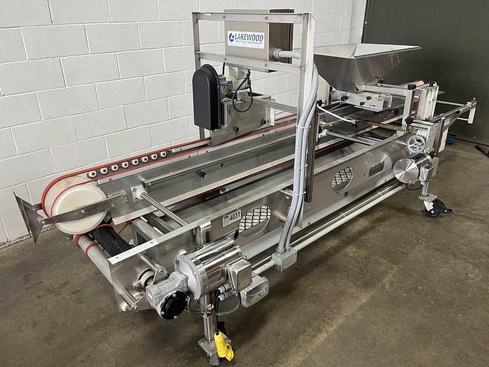Used Lakewood 31025 Volumetric Clamshell Filler