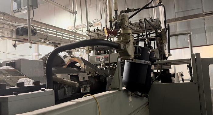 Used UNILOY R2000 BLOWMOLDER WITH 10041 TRIMMER AND COOLING BED 