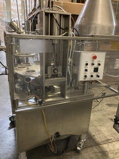 Used World Cup Rotary Filler