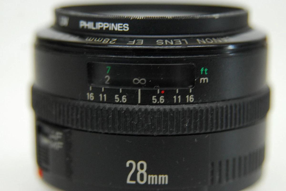 Used Canon EF 28mm 1:2.8 EOS Lens W/ HOYA 52mm UV Filter