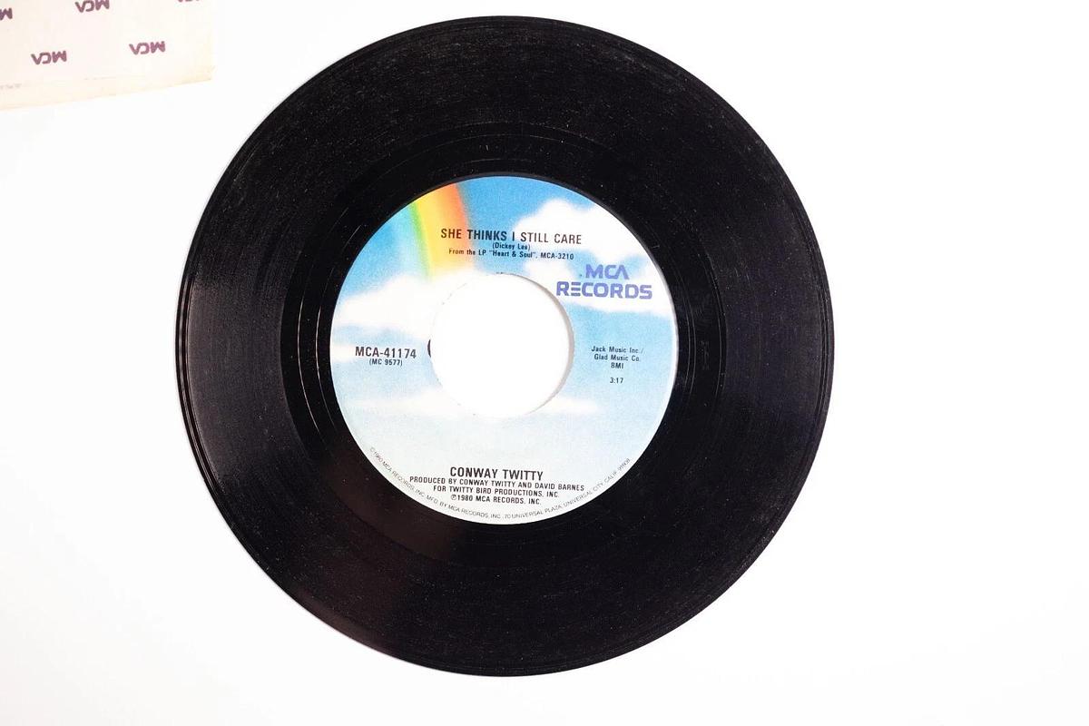 Used Conway Twitty, She Thinks I Still Care, I'd Just Love To Lay You Down 45 Record