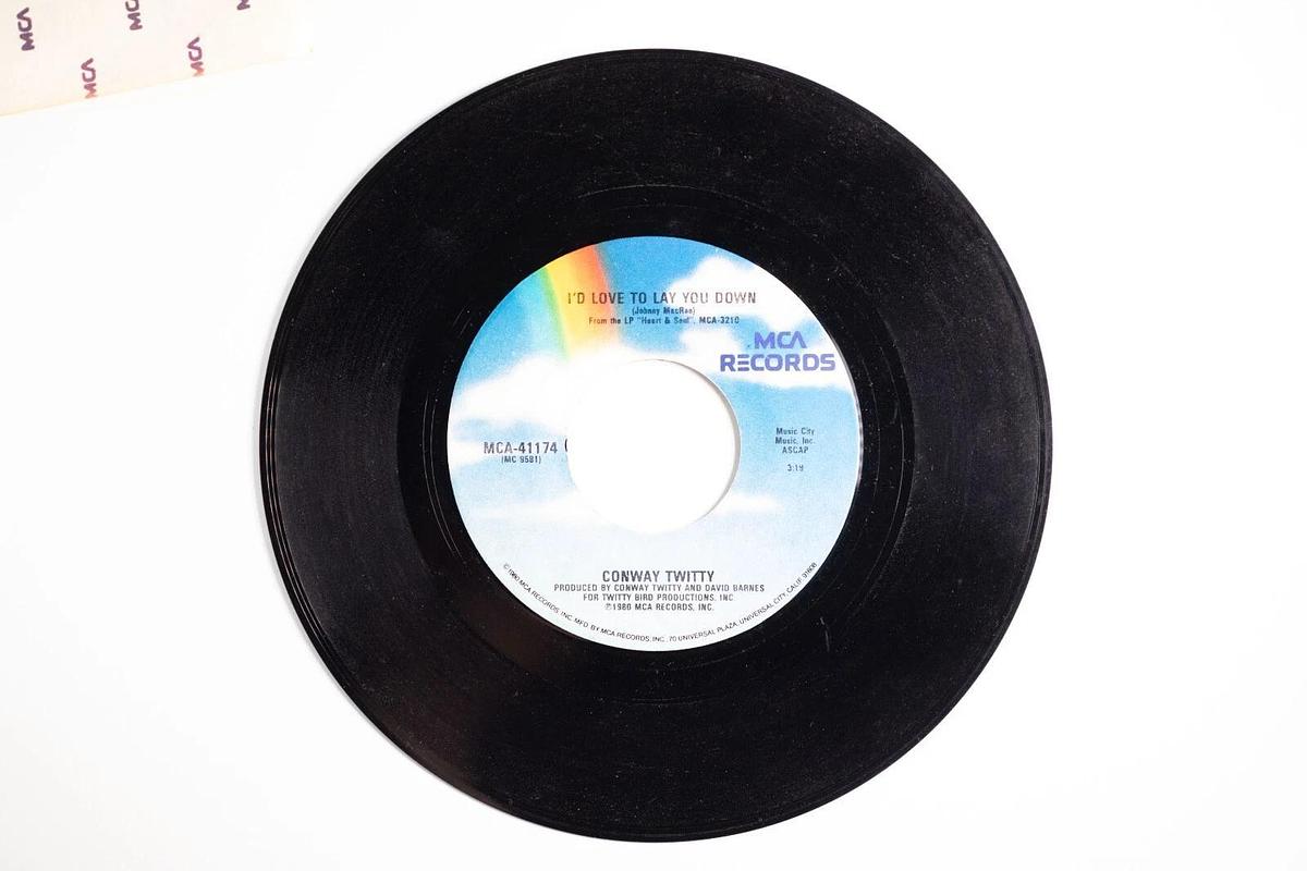 Used Conway Twitty, She Thinks I Still Care, I'd Just Love To Lay You Down 45 Record