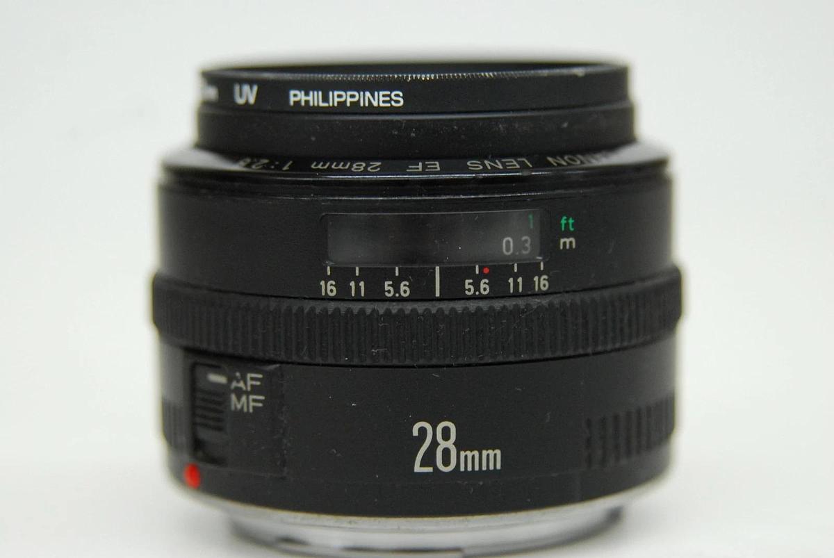Used Canon EF 28mm 1:2.8 EOS Lens W/ HOYA 52mm UV Filter