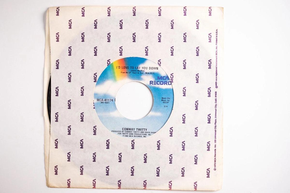 Used Conway Twitty, She Thinks I Still Care, I'd Just Love To Lay You Down 45 Record
