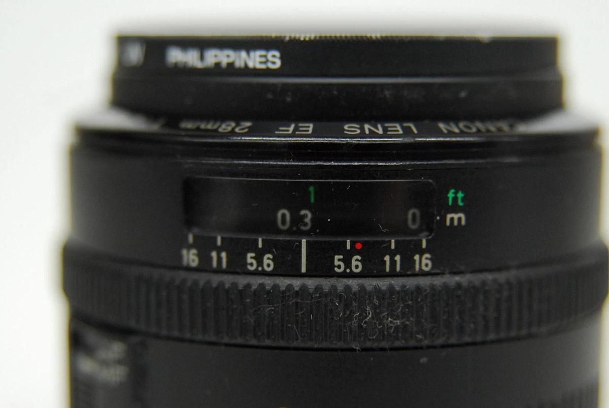 Used Canon EF 28mm 1:2.8 EOS Lens W/ HOYA 52mm UV Filter