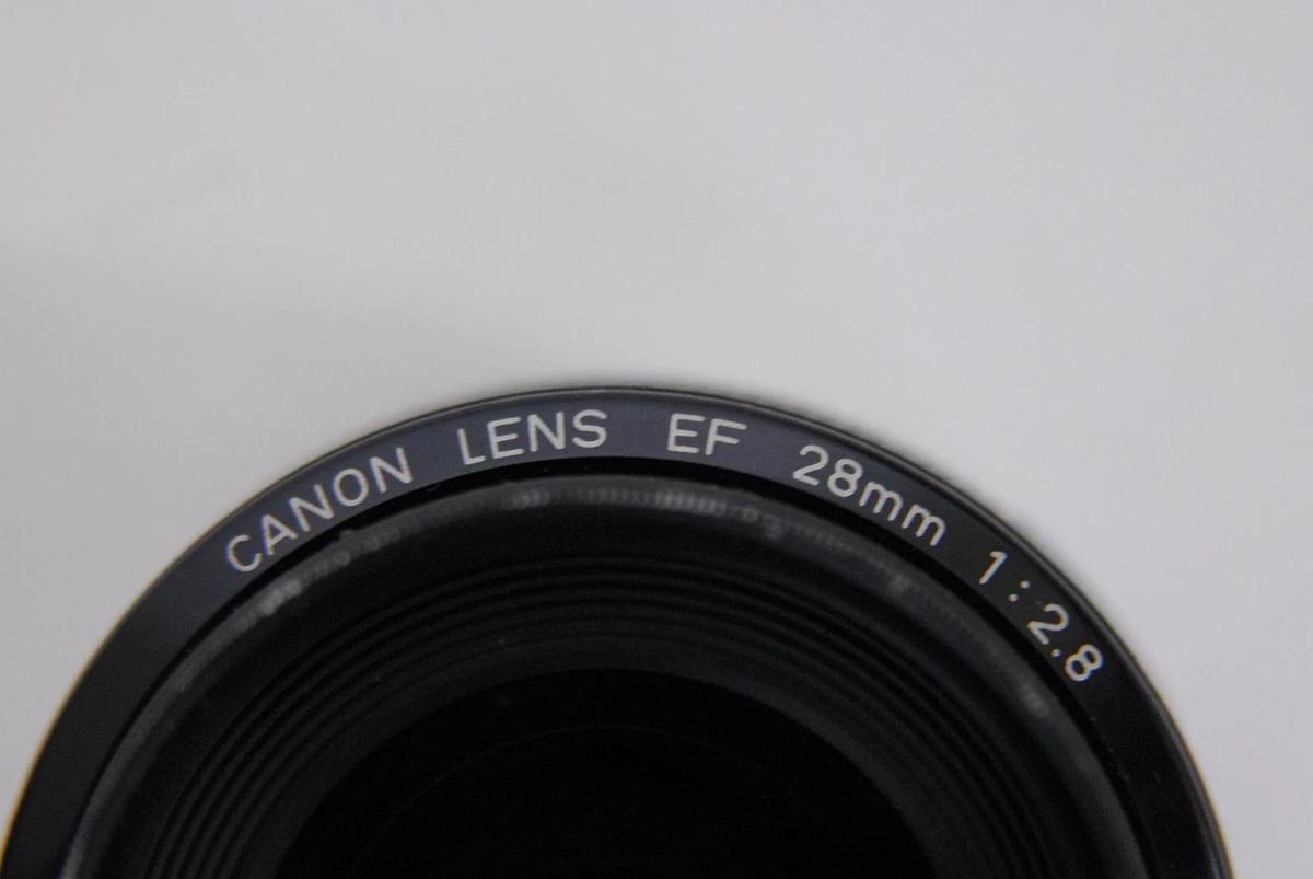 Used Canon EF 28mm 1:2.8 EOS Lens W/ HOYA 52mm UV Filter