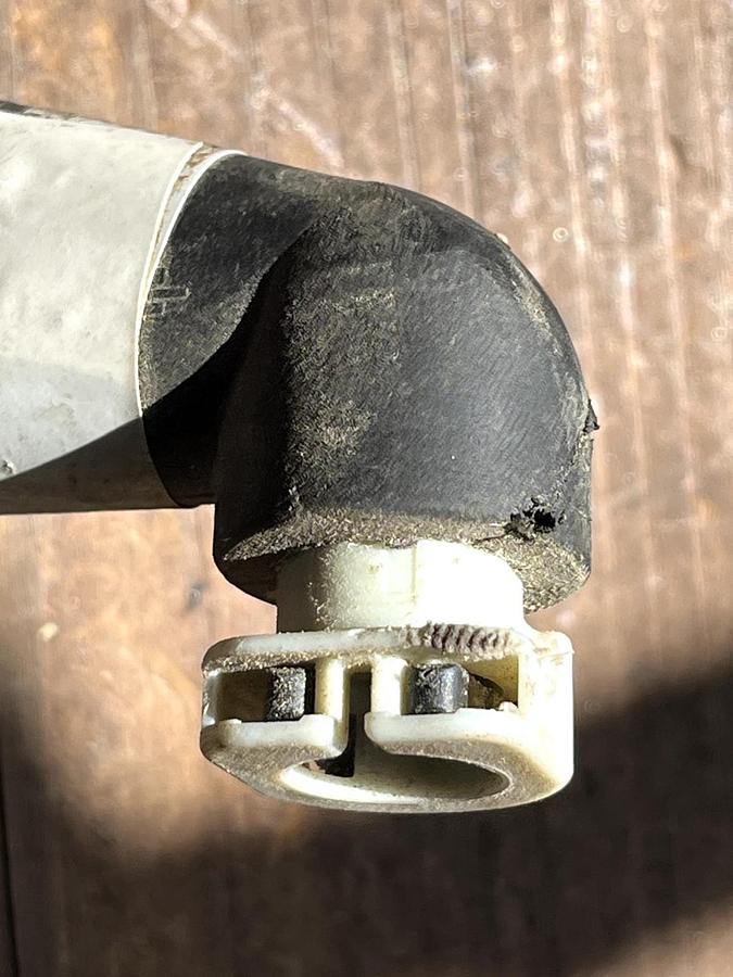 Used CAT Part # 506-5802.  BACK FLOW / RETURN WHITE PUMP CONNECTOR.  NEW.