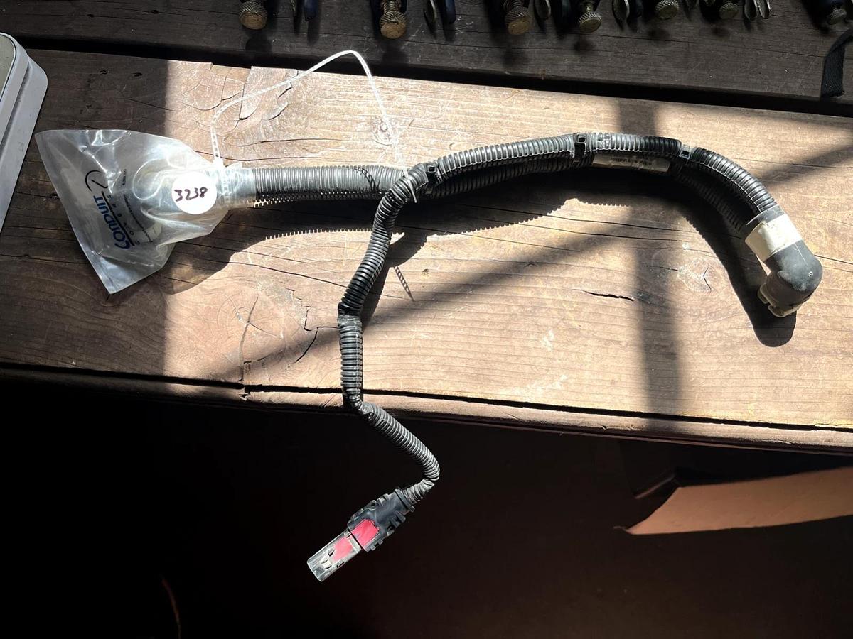 Used CAT Part # 506-5802.  BACK FLOW / RETURN WHITE PUMP CONNECTOR.  NEW.