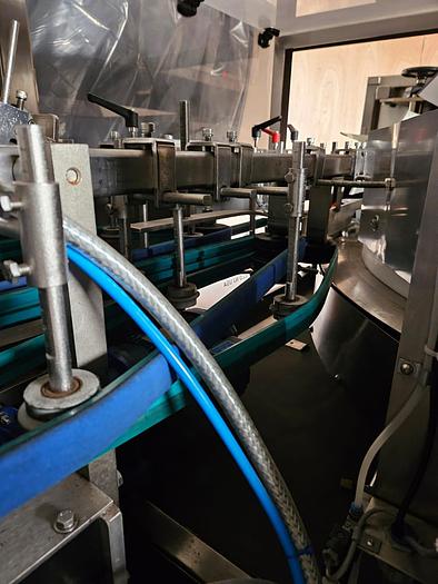 Used BOTTLE UNSCRAMBLER WITH HOPPER ELEVATOR